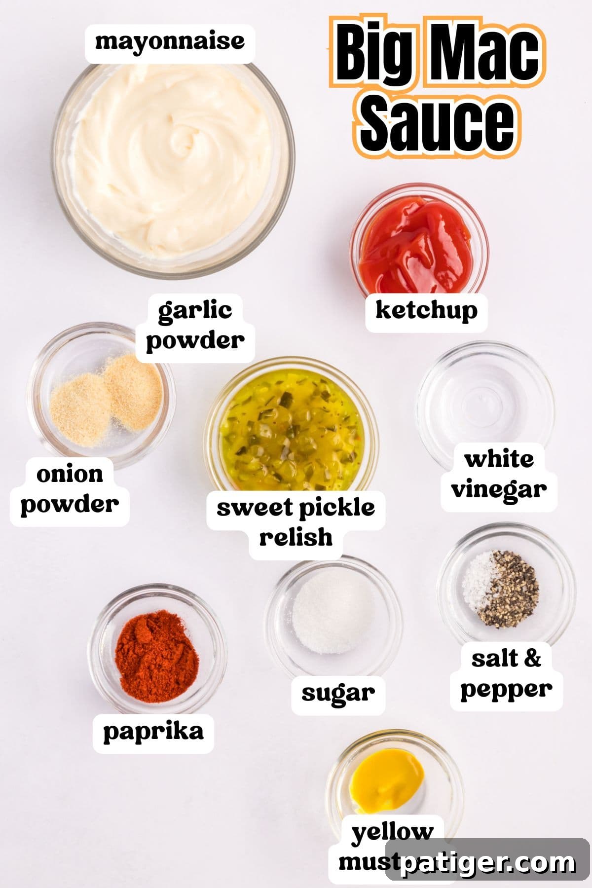 Ingredients laid out for making Copycat Big Mac Sauce: mayonnaise, ketchup, yellow mustard, white vinegar, sweet pickle relish, paprika, salt, pepper, onion powder, garlic powder, and sugar.