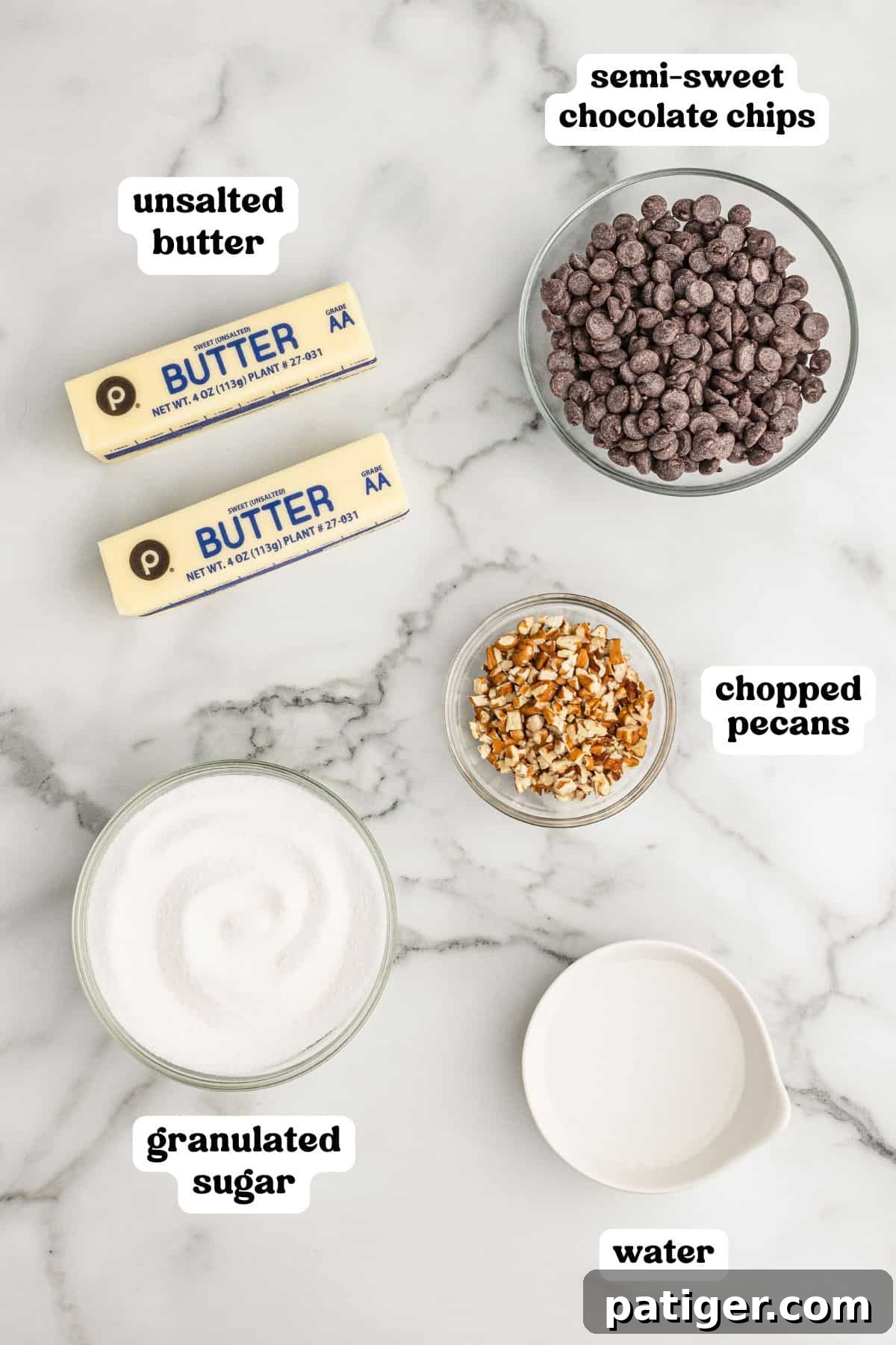 Labeled ingredients for making homemade English toffee, including unsalted butter, semi-sweet chocolate chips, chopped pecans, granulated sugar, and water.