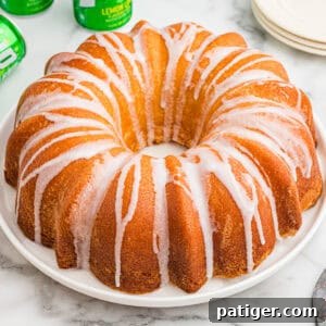 7 Up pound cake with glaze drizzled over the top.