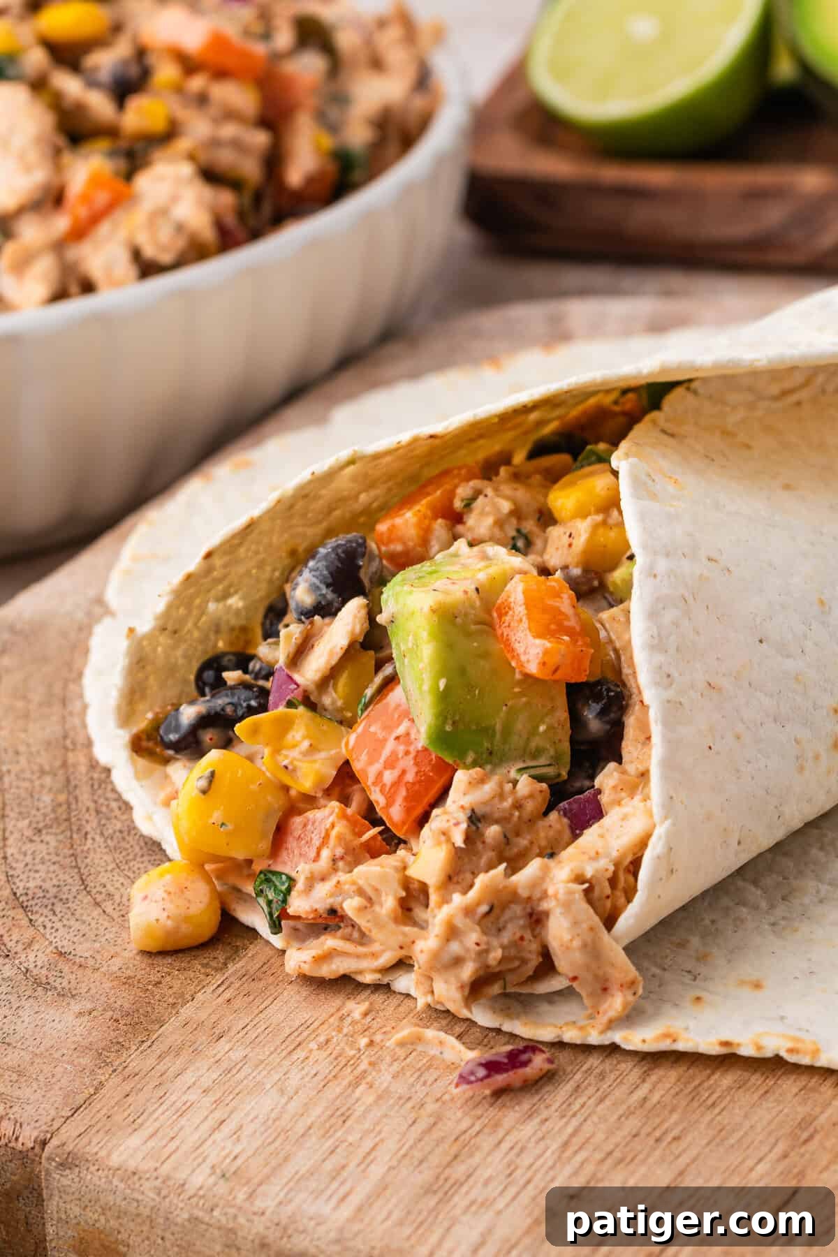 Southwest chicken salad wrapped in a flour tortilla with avocado, corn, black beans, and peppers.