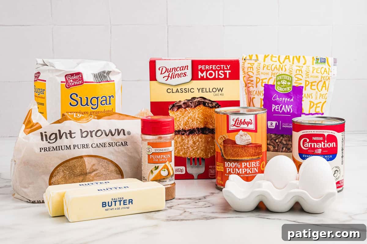 Ingredients on a marble counter: granulated sugar, light brown sugar, pumpkin pie spice, butter, yellow cake mix, chopped pecans, canned pumpkin, evaporated milk, and eggs.